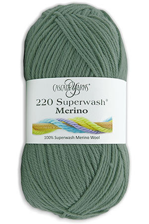 A skein of Cascade Yarns 220 Superwash Sport 100% Superwash Merino Wool in a solid rich purple color. The label is white with text and a small colored image strip at the top.