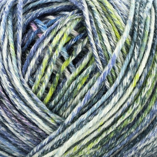 A close-up image of a ball of yarn. The yarn features a mix of colors including shades of blue, green, white, and gray, with a variegated pattern. The strands are tightly wound together, showcasing the texture and color variations.