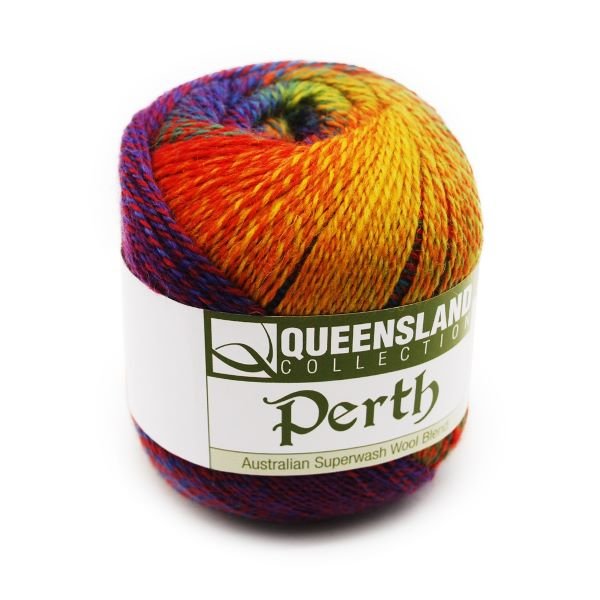 A ball of Queensland Collection Perth yarn is shown. The yarn consists of a mix of vibrant colors, including red, yellow, green, blue, and purple. The label on the yarn indicates it is made from Australian Superwash Wool Blend.