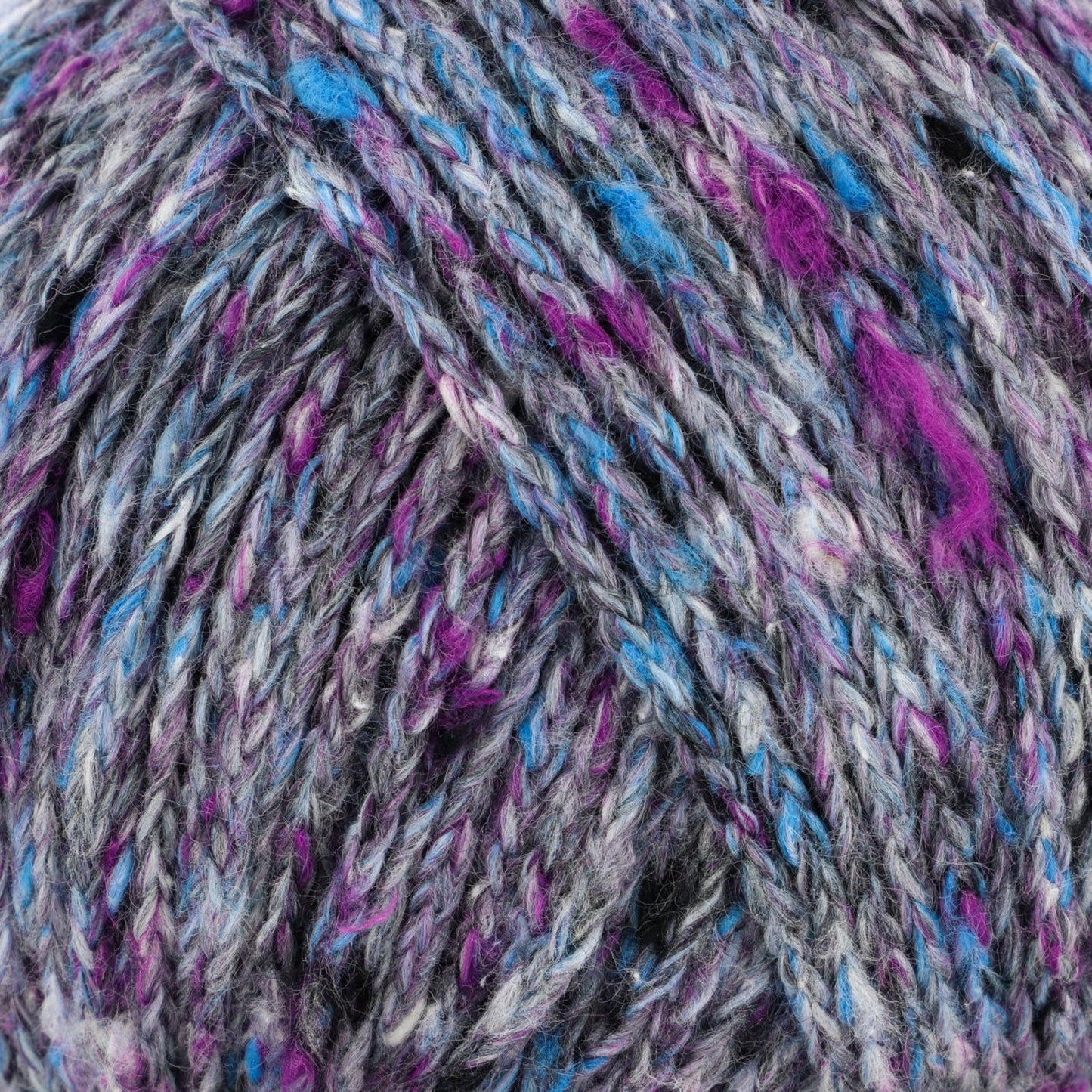 A close-up image of a ball of multi-colored yarn featuring a mix of gray, purple, blue, and pink fibers woven together in a variegated pattern. The textures of the yarn strands are clearly visible.