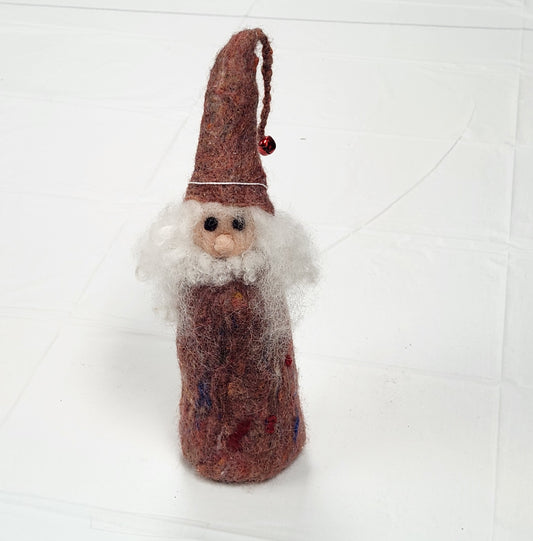 A hand-felted wizard doll with a red hat and blue body, standing against a white background.