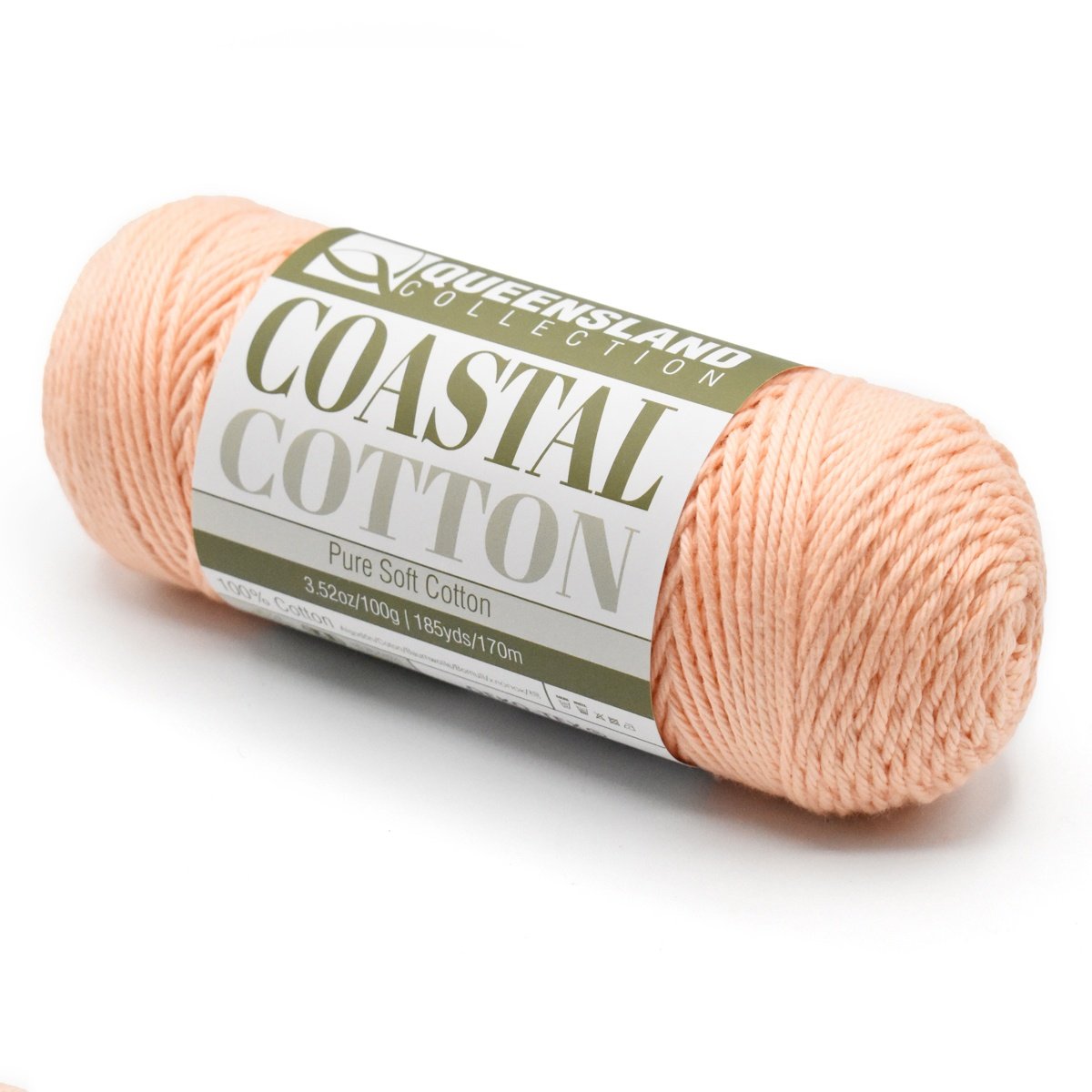 A skein of Queensland Collection Coastal Cotton yarn in a soft peach color. The label indicates it is made of pure soft cotton, weighing 3.5 ounces (100 grams), and measures 186 yards (170 meters).