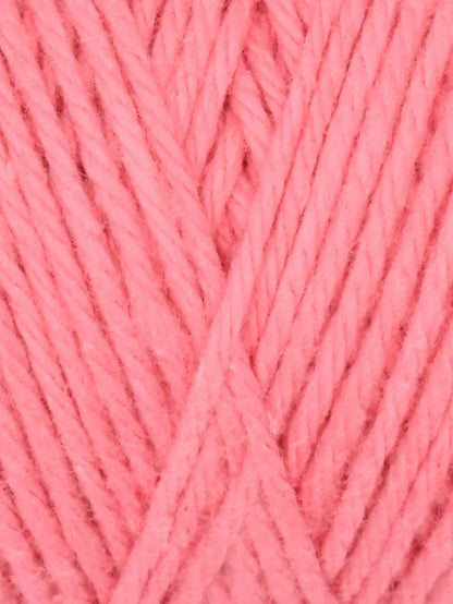 A skein of Queensland Collection Coastal Cotton yarn in a soft peach color. The label indicates it is made of pure soft cotton, weighing 3.5 ounces (100 grams), and measures 186 yards (170 meters).