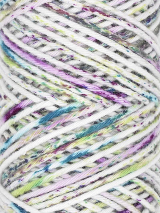 A skein of Queensland Collection Coastal Cotton yarn in the Ocean Mist colorway. The label indicates it is made of 100% pure soft cotton, weighs 100g, measures 170m, and is OEKO-TEX certified. The yarn is multicolored with shades of white, blue, and pink.